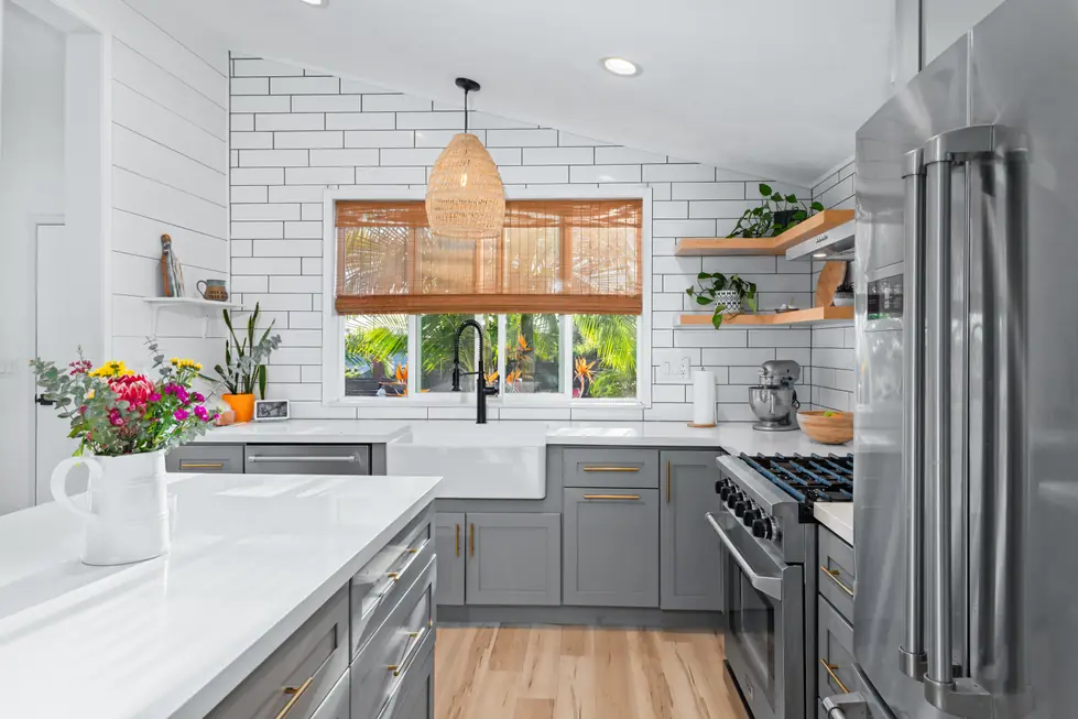 A high end kitchen with island seating, photographed with bracketed exposures